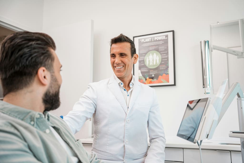 Dentist consulting with a patient